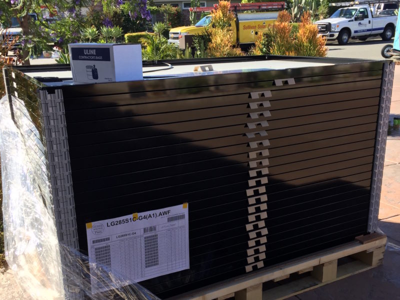 22 solar panels arrived in this lovely stack. They were larger than I imagined them.